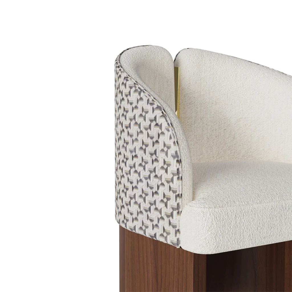 Melli bouclé dining chair details by Nolita Harbour, luxury upholstered chair with curved shell, walnut base, and refined brass detail.
