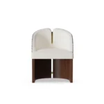 Melli designer dining chair by Nolita Harbour, bouclé upholstered chair with twin curved back panels and refined wood base.