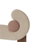 Mia bouclé armchair detail by Nolita Harbour, luxury lounge chair with curved shell and refined wood base.