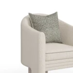 Nina bouclé dining chair detail by Nolita Harbour, luxury upholstered chair with continuous curved shell and modern sculptural form.