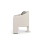 Nina upholstered dining chair by Nolita Harbour, bouclé chair with soft curved back and calm architectural profile.
