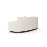 Back view of Nina designer sofa by Nolita Harbour, linear bouclé sofa with recessed wood base and calm, refined silhouette.
