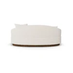 Back view of Nina bouclé sofa by Nolita Harbour, luxury upholstered sofa with continuous shell and walnut base, refined modern design.