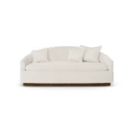 Nina luxury sofa by Nolita Harbour, bouclé lounge sofa with walnut base, elegant proportions and clean architectural lines.