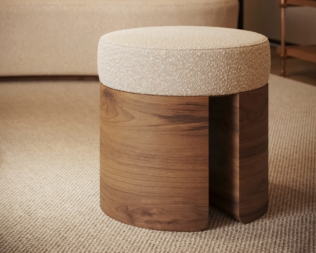 Front view of Pauline Stool with round upholstered seat and walnut base