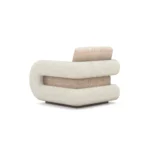 Noor armchair by Nolita Harbour, sculptural bouclé chair with organic rounded form and elegant walnut base.