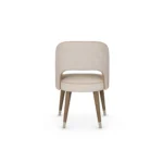Paris dining chair by Nolita Harbour, upholstered seat with walnut frame and sculptural modern dining design.