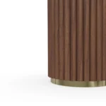 Roland Side Table, a sculptural side table by Nolita Harbour crafted in marble and wood, with a round silhouette and textured base.