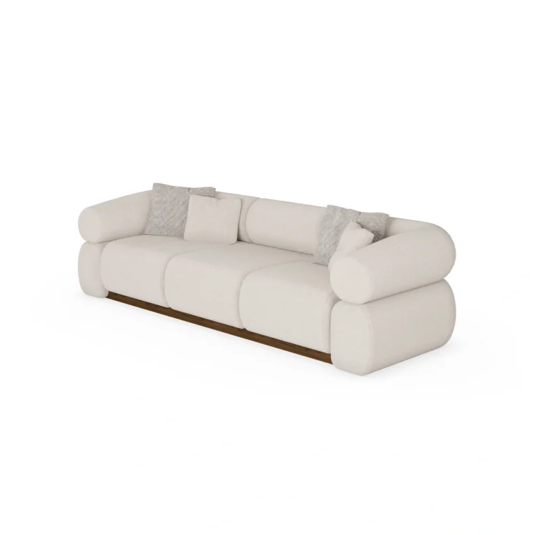 Soléne sectional sofa by Nolita Harbour, bouclé upholstered sofa with walnut base and cylindrical arms, sculptural curved design.