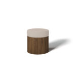 Side view of Pauline Stool showcasing walnut base and cushioned seat