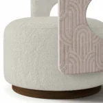 Tess bouclé armchair detail by Nolita Harbour, luxury accent chair with sculptural shell and refined walnut structure.