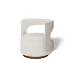 Tess armchair by Nolita Harbour, sculptural bouclé chair with continuous curved shell and elegant walnut frame.