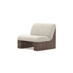 Modern armchair with cream upholstery, featuring ribbed walnut base and plush seating, designed by Nolita Harbour. 45 degree