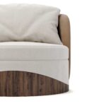 Round luxury armchair with cream fabric, beige accents, and a walnut wood wavy base, featuring a plush cushion, designed by Nolita Harbour. Detail view