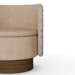 Beige luxury armchair with patterned fabric back and sides, and a walnut base, designed by Nolita Harbour.