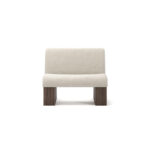 Modern armchair with cream upholstery, featuring ribbed walnut base and plush seating, designed by Nolita Harbour. front view