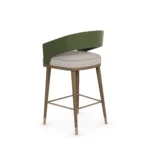 Ava velvet bar chair by Nolita Harbour, luxury upholstered stool with matte walnut legs and polished brass footrest.