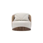 Balli velvet armchair by Nolita Harbour, rounded lounge chair with bouclé upholstery and refined walnut plinth.