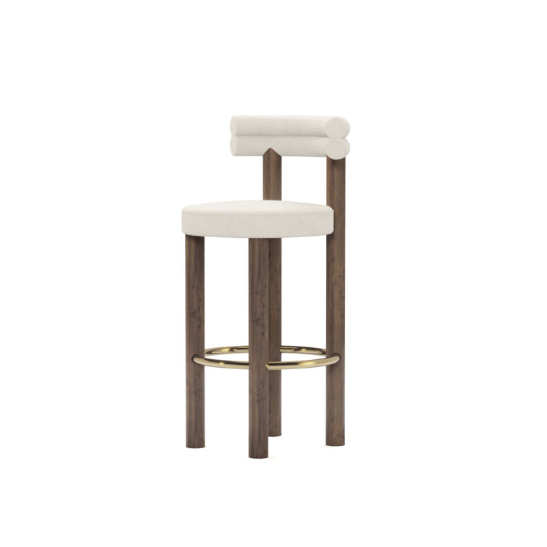 Modern luxury bar chair with cream upholstery, double-roll backrest, walnut legs, and brass-finished footrest, designed by Nolita Harbour.