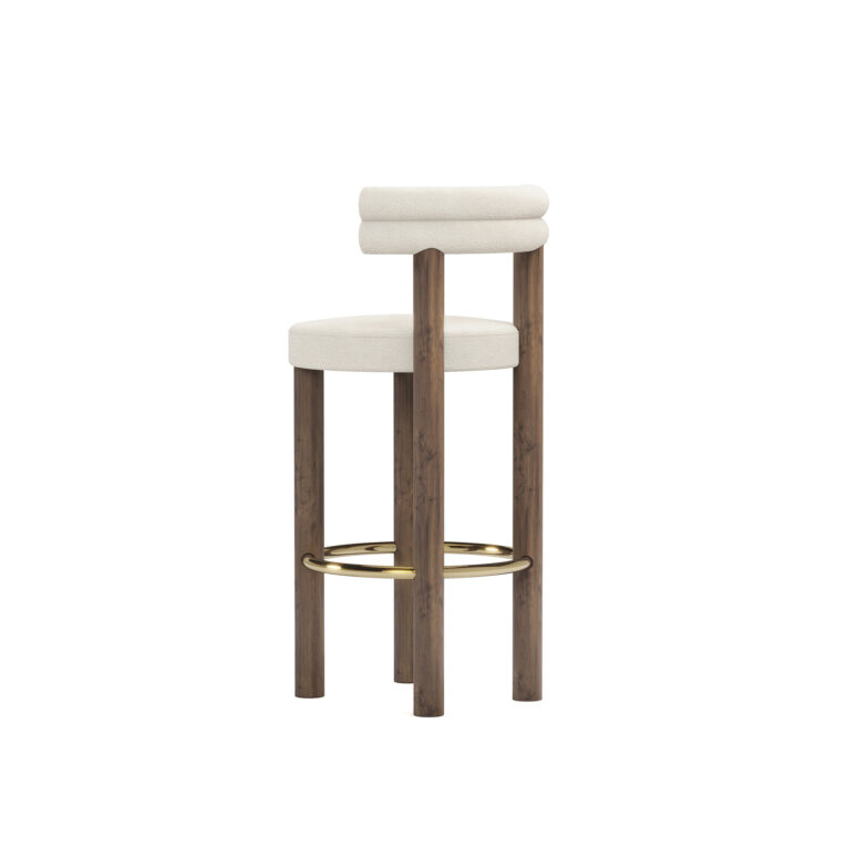 Modern luxury bar chair with cream upholstery, double-roll backrest, walnut legs, and brass-finished footrest, designed by Nolita Harbour. 45 degree