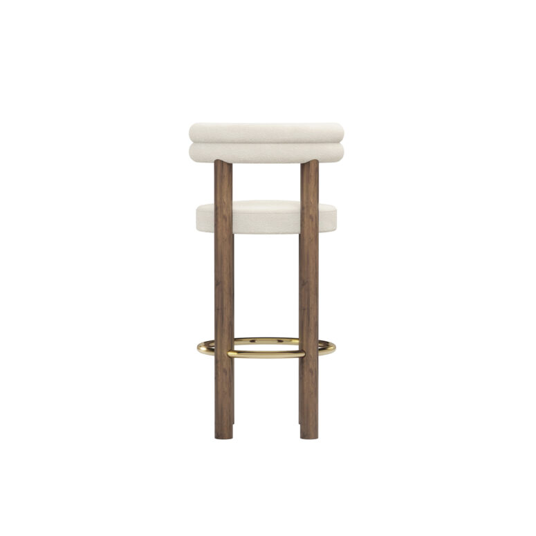 Modern luxury bar chair with cream upholstery, double-roll backrest, walnut legs, and brass-finished footrest, designed by Nolita Harbour. Back view