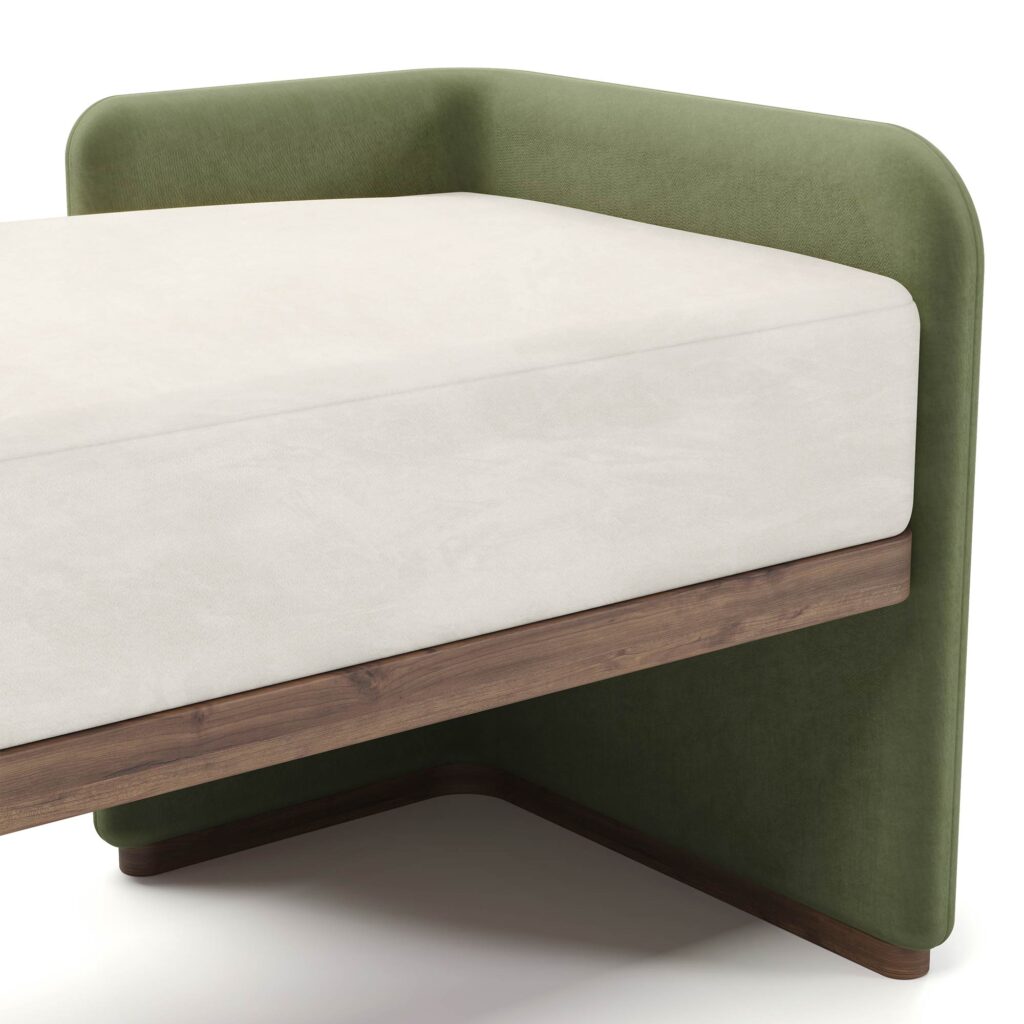 Luxury bench with ivory upholstered seat, green fabric ends, and walnut base, designed by Nolita Harbour. detail view