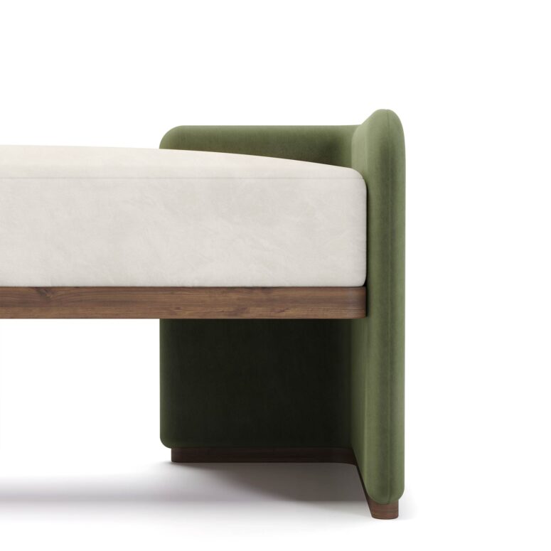 Luxury bench with ivory upholstered seat, green fabric ends, and walnut base, designed by Nolita Harbour. detail view