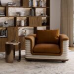 Nolita Harbour furniture demonstration with the premium travertine Bria side table and the luxury velvet Celine armchair.