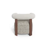 Claire armchair by Nolita Harbour, sculptural upholstered chair with walnut frame, tailored seat, and architectural silhouette.