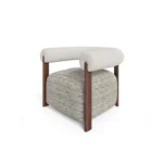 Claire armchair by Nolita Harbour, upholstered armchair with walnut frame and cylindrical arms, sculptural contemporary design.