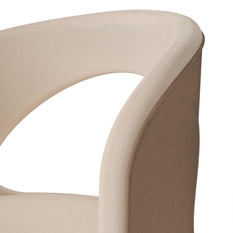 Beige luxury dining chair with a curved open-back design, linen upholstery, and walnut accent detail by Nolita Harbour. detail view