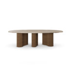 Santi dining table with travertine top, brass frieze, and ribbed walnut matte base. front view