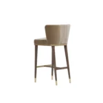Hazel bar stool by Nolita Harbour, velvet upholstered chair with tapered wood legs and sculptural supportive silhouette.