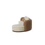 Latte velvet sofa by Nolita Harbour, luxury curved sofa side view, with bouclé shell and walnut base, soft cushions and tailored form.