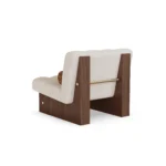 Mika armchair by Nolita Harbour, sculptural bouclé chair with seamless upholstery and elegant wood base.