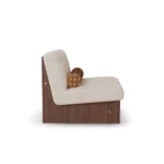 Mika luxury armchair by Nolita Harbour, curved bouclé lounge chair with supportive back and discreet walnut base.