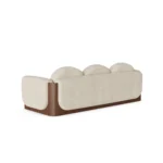 Noah upholstered sofa by Nolita Harbour, velvet sectional with soft radii and continuous walnut base, modern architectural design.