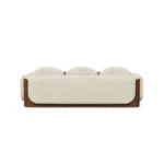 Noah curved sectional sofa by Nolita Harbour, velvet upholstered modular sofa with soft edges and architectural walnut base.