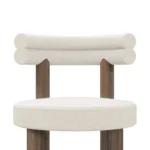 Odette bouclé bar chair details by Nolita Harbour, luxury upholstered stool with solid walnut frame and refined brass detail.