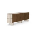 Peter Sideboard, an architectural sideboard by Nolita Harbour in walnut, travertine, and velvet, with flowing lines and refined finishes