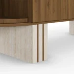 Luxury sideboard with travertine top, walnut wood, rounded lines, velvet-covered sides, and three legs, designed by Nolita Harbour. detail view