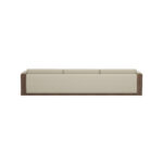 Modular sofa with cream upholstery and walnut panels, featuring a customizable configuration, designed by Nolita Harbour. detail view. Back view