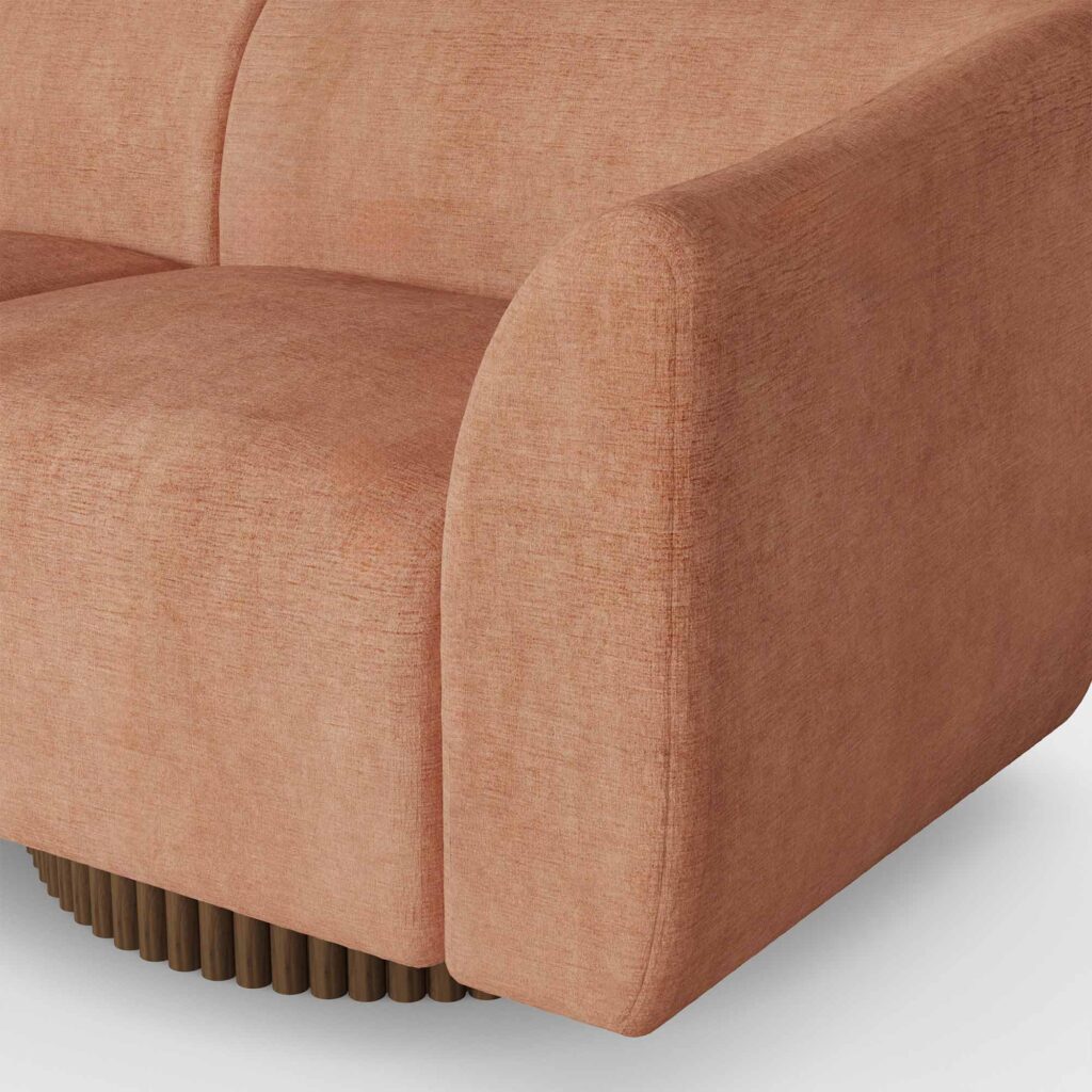 Orange luxury sofa with wave-inspired design, featuring plush upholstery, ribbed walnut matte base, and neutral-colored cushions, by Nolita Harbour. detail view