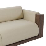 Modular sofa with cream upholstery and walnut panels, featuring a customizable configuration, designed by Nolita Harbour. Detail view