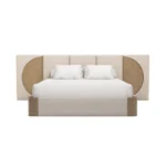 Claude Bed by Nolita Harbour, a designer bed in carved oak and bouclé upholstery with an oversized headboard.