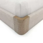 Claude Bed as a luxury bed, made by Nolita Harbour, crafted in carved oak and soft bouclé with tall headboard.