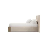 Claude Bed, a designer oak bed by Nolita Harbour with bouclé headboard and warm textured materials.