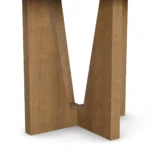 Modern dining table with a travertine top and varnished oak legs, featuring an organic-shaped tabletop and a sculptural base, by Nolita Harbour. detail view