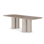 Luxury dining table with Light Emperador marble top and cylindrical marble legs, featuring a minimalistic and elegant design, by Nolita Harbour. 45 degree