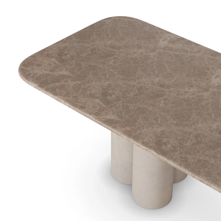 Luxury dining table with Light Emperador marble top and cylindrical marble legs, featuring a minimalistic and elegant design, by Nolita Harbour. detail view